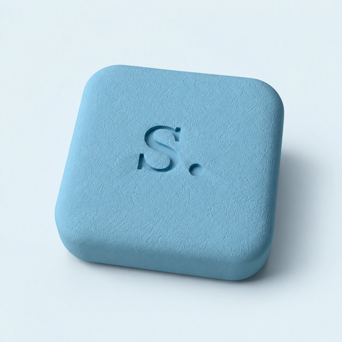 Powder-blue signal-rx tablet with recessed S. imprint on pale blue.