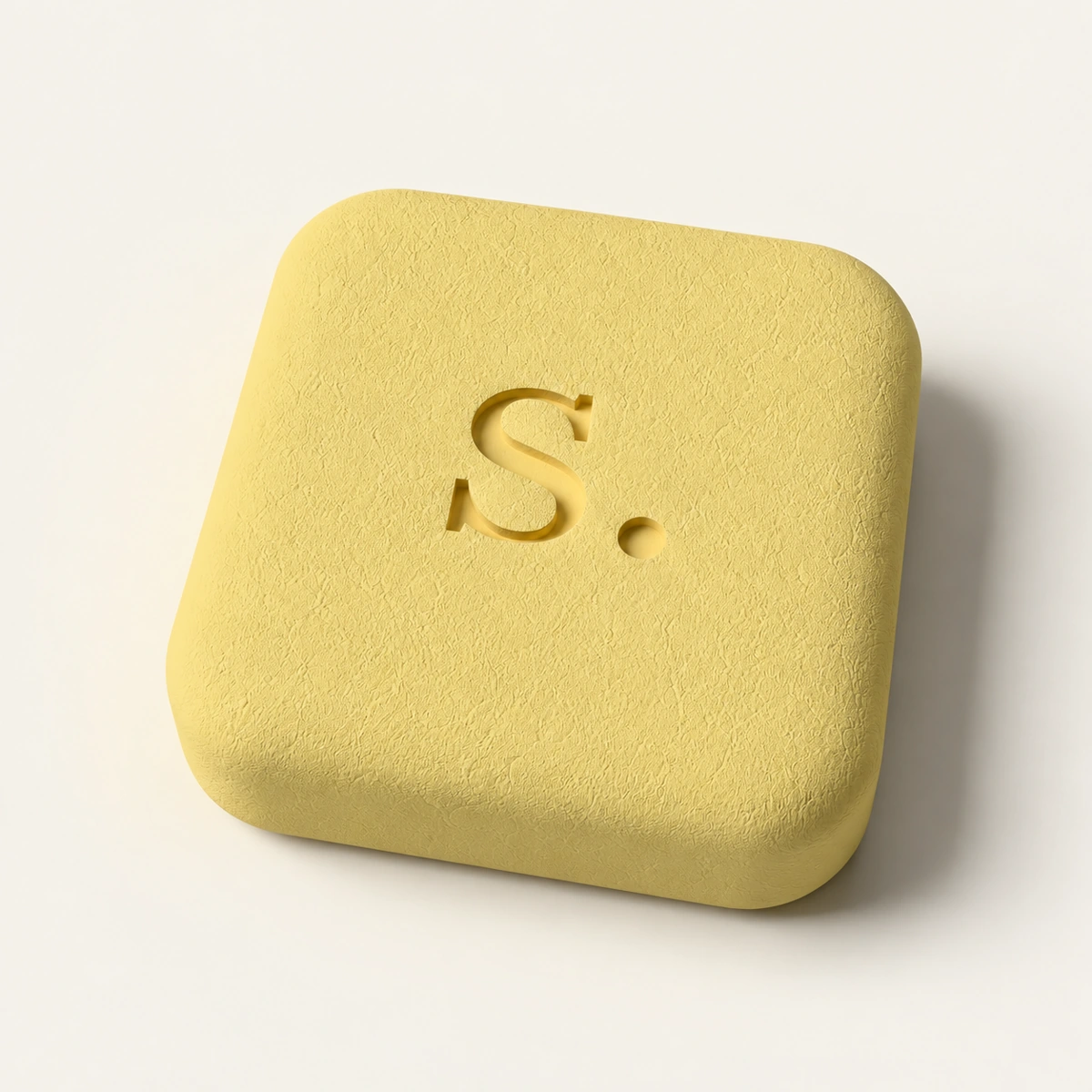 Yellow signal-rx tablet with recessed S. imprint on cream.